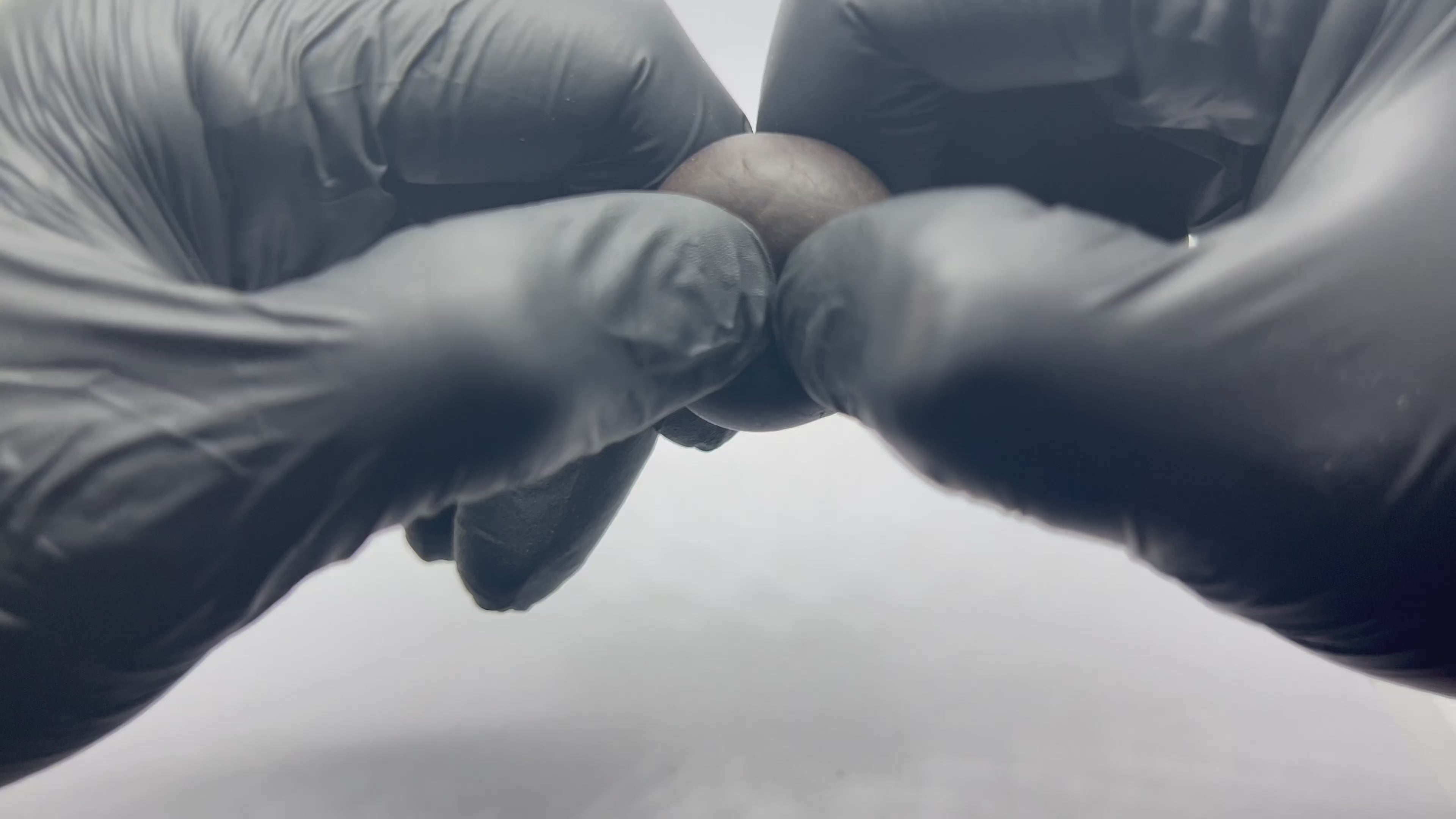 Black Afghan CBD 5g hash ball opening up 